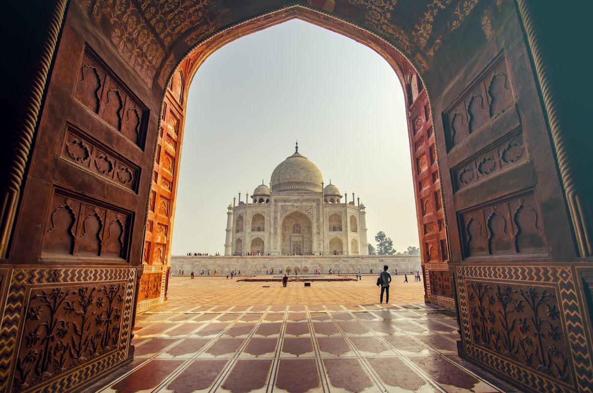 Taj Mahal at sunrise with reflecting pool in foreground